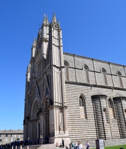 It is positioned near the Tufa cliffs of the hill town; so you can see the Duomo from miles around.